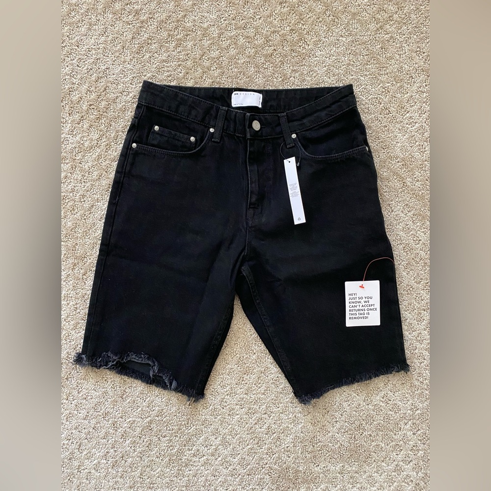 ASOS Designs slim denim shorts in black with raw hem